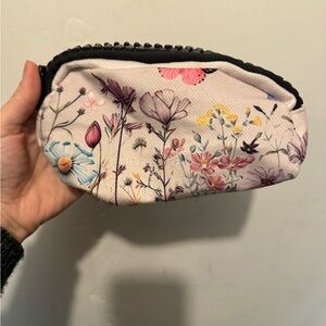 Small cosmetic bag with extra large zipper